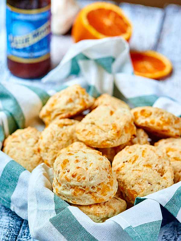 basket of biscuits, bottle of beer in background