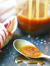 This vanilla bourbon salted caramel sauce totally speaks for itself. It's creamy, a little bit salty, and is perfectly hinted with vanilla and bourbon. showmetheyummy.com #caramel #icecream #saltedcaramel #bourbon #whiskey
