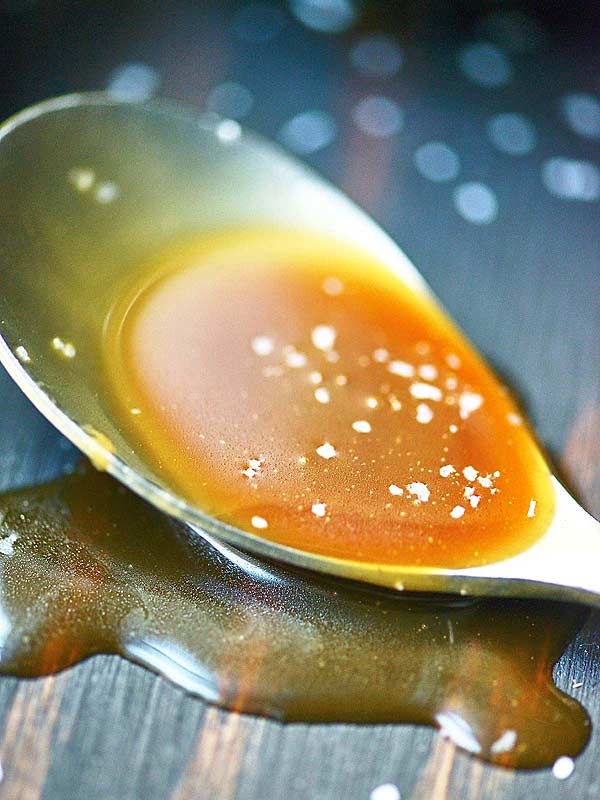 spoon of salted caramel sauce