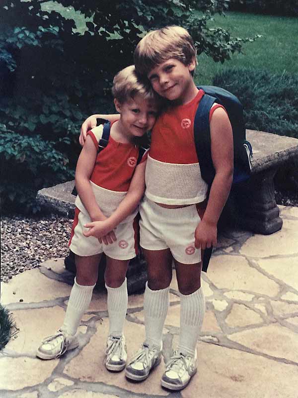 two young brothers, hugging