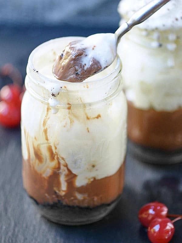 scoop of pudding being taken out of jar