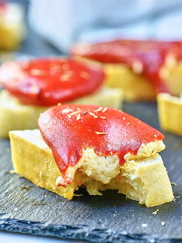 goat cheese stuffed piquillo pepper on bread