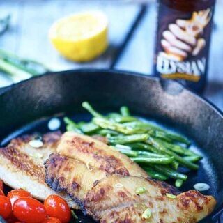 This honey, soy, and garlic tilapia is perfect for a quick and easy weeknight meal! It's healthy, delicious, and comes together in a matter of minutes! showmetheyummy.com #easyrecipes #healthy #honey #soysauce #garlic #tilapia #fish #seafood