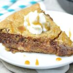 Snickers Stuffed Deep Dish Chocolate Chip Cookie. Made in a skillet, this cookie is thick, gooey, and has that great sweet/salty combo! Top it with cookie dough ice cream to take this dessert over the top! showmetheyummy.com #deepdish #cookie #snickers #candy #skillet #dessert #chocolate #icecream