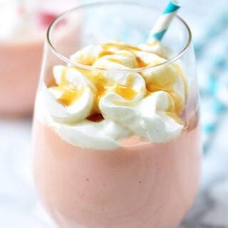 This Tropical Spiked Cake Shake will immediately transport you to some place tropical! It's so thick, creamy, and sweet. It takes like cake batter and is filled with cherries, pineapple, and of course, Malibu Rum! showmetheyummy.com #icecream #milkshake #shake #malibu #rum #tropical #cake #pineapple #coconut #cherries