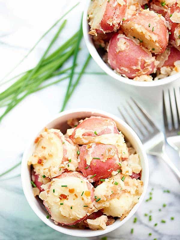 two bowls of german potato salad above