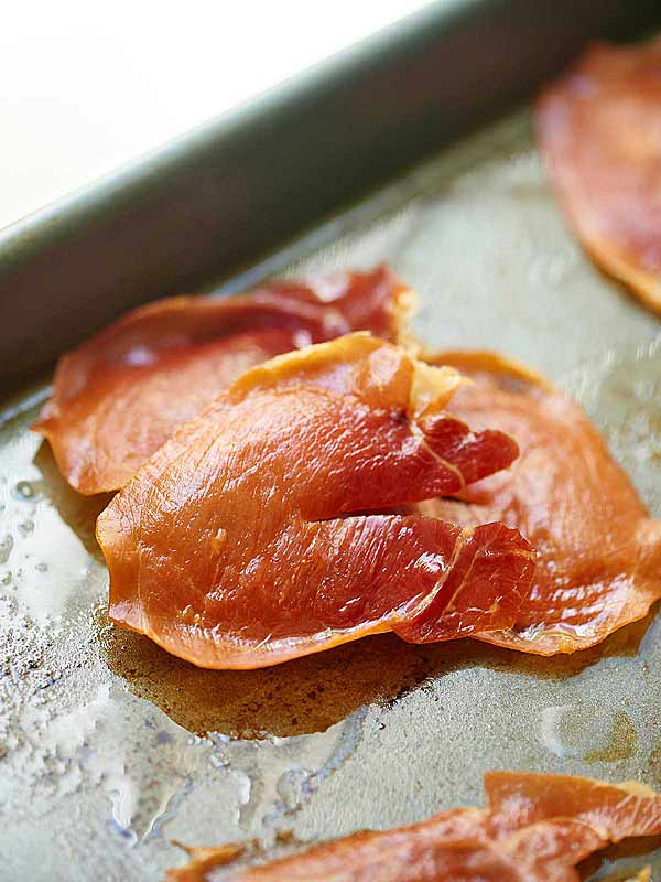 cooked prosciutto on baking sheet