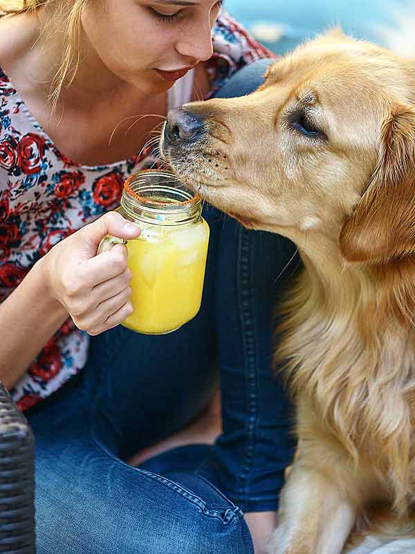 Woman and dog with margarita