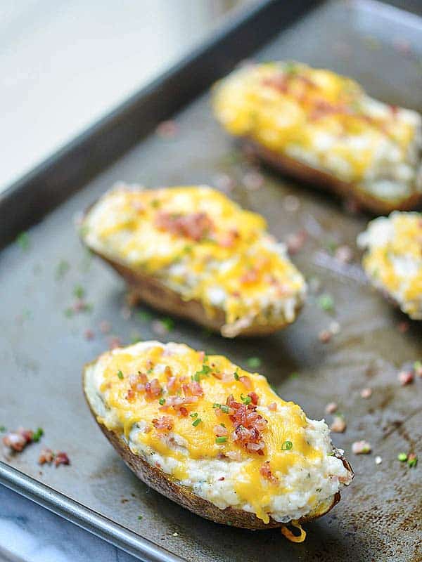 jalapeno popper twice baked potatoes on baking sheet