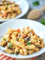 This Mexican Pasta Salad needs to make an appearance at your next grill out. A fun textured pasta + fresh crunchy veggies + black beans + a kick butt sauce! showmetheyummy.com #mexicanfood #pasta #salad #mexicanpastasalad #pastasalad #grilling #sidedish #vegetarian