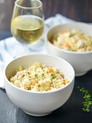 This one pot chicken bacon couscous really is a one pot wonder! Full of chewy bacon, tender chicken, crunchy veggies, and seasonings, this dish makes for a great dinner and even better leftovers! showmetheyummy.com #onepot #dinner #chicken #bacon #couscous #pasta #wine #easy #recipes