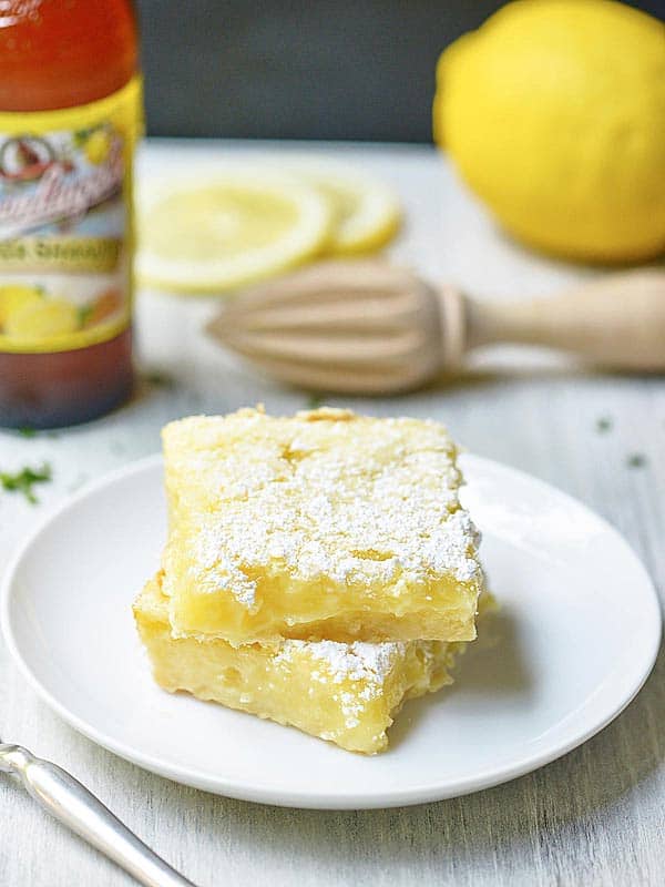 two summer shandy lemon bars on plate stacked