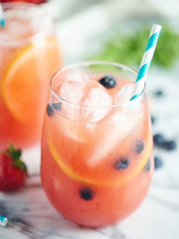 glass of watermelon sangria with straw