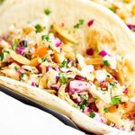 Beer Battered Fish Tacos w/ Asian Slaw. Flour tortillas stuffed with crispy, golden, tender, beer battered cod and topped with toasty, crunchy, fresh coleslaw! showmetheyummy.com #seafood #tacos
