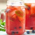 This Blueberry Peach Mojito is the drink of all summer drinks! Peach puree, a homemade blueberry simple syrup, fresh mint, and rum. It's cocktail time! showmetheyummy.com #mojito #cocktail