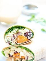 This healthy sweet potato wrap is hearty, vegetarian & full of good for you ingredients like black beans, brown rice & is drizzled in a unique tahini sauce! showmetheyummy.com