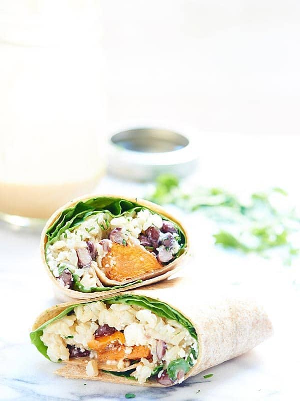 Two halves of healthy sweet potato wrap stacked