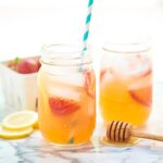 This honey strawberry lemonade only has four ingredients and is naturally sweetened! Perfect for kids! Add a shot of gin for an adults only cocktail! showmetheyummy.com #honey #lemonade