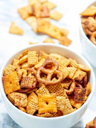 Chex mix that's made in the crockpot?! Yes please! This slow cooker chex mix is easy to make, flavored w/ ranch seasoning, & addicting! You've been warned. showmetheyummy.com #slowcooker #chexmix