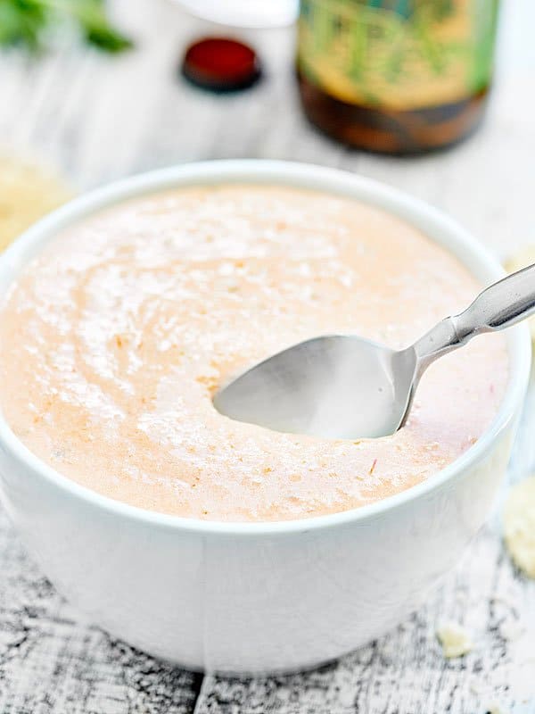 Spoon in bowl of salsa dip