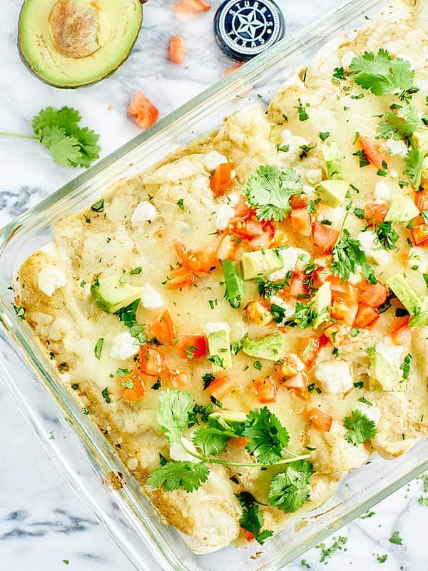 baking dish of green chile chicken enchiladas above