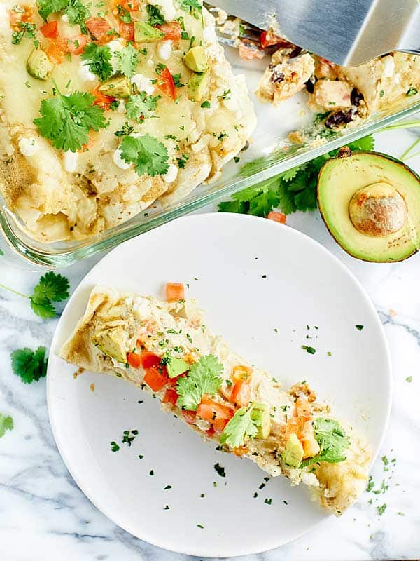 green chile chicken enchilada on plate above