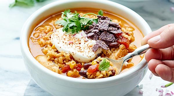 Cozy up with this One Pot Mexican Chicken and Rice Soup! It's healthy, hearty, and so full of flavor! Bonus: only ONE DISH and 5 minutes of prep necessary! showmetheyummy.com #soup #healthy
