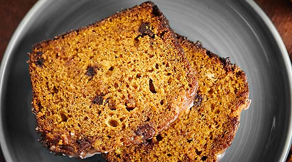 This Pumpkin Bread Recipe is studded w/ chocolate chips, butterscotch chips, & is so moist & easy! It tastes like fall. It can also be made into muffins! showmetheyummy.com #pumpkin #bread