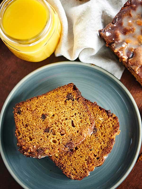two slices of pumpkin bread on plate above
