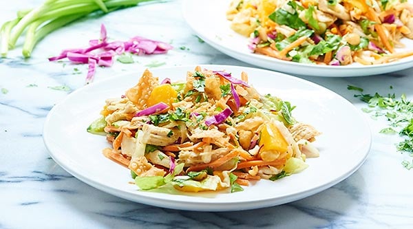 Bring this Thai Chicken Salad to work & you'll have the best lunch there. With so many great textures, fresh flavors, & tangy dressing, you'll never get bored! showmetheyummy.com #salad #healthy