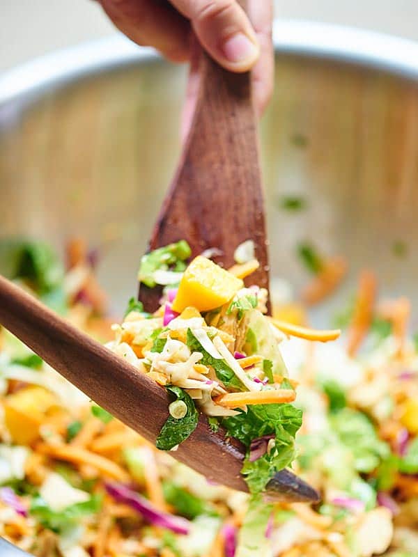 Thai chicken salad being mixed
