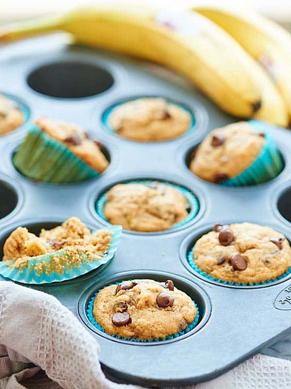banana chocolate chip muffins in muffin tin