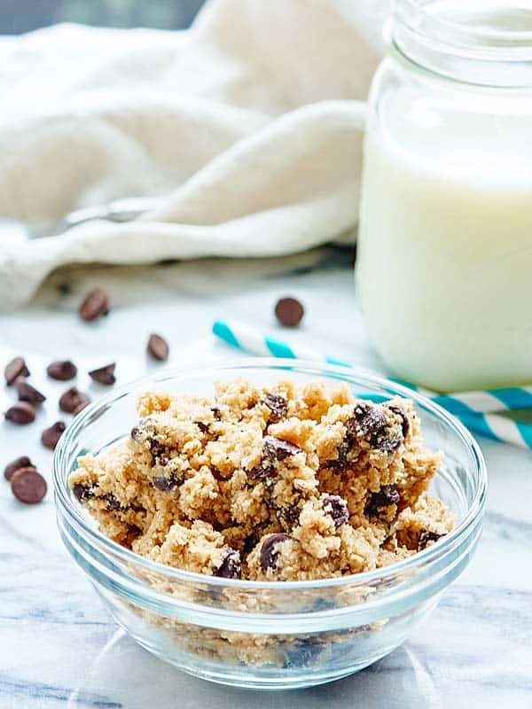 bowl of edible cookie dough, jar of milk in background