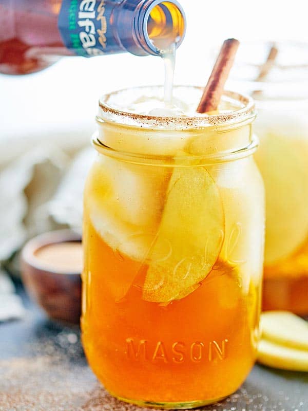 ginger beer being poured into jar of sangria