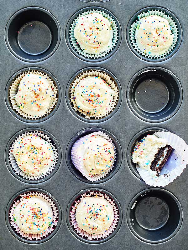 funfetti cheesecake cupcakes in muffin tin above