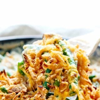 This is the BEST Green Bean Casserole Recipe. It's creamy and full of bacon, mushrooms, cheddar cheese, and French-Fried Onion Rings! The perfect side dish. showmetheyummy.com #bacon #greenbeancasserole