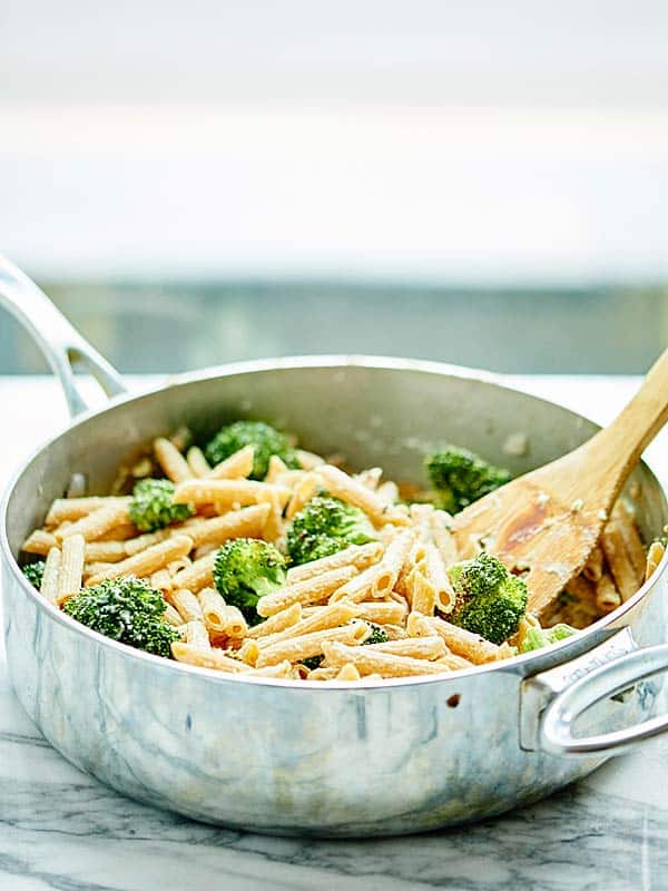 saute pan with vegan alfredo and broccoli