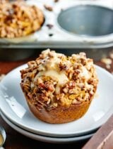 These healthy vegan pumpkin muffins are made w/ whole wheat flour & are naturally sweetened w/ maple syrup! They're topped w/ pecan streusel & maple glaze! showmetheyummy.com #pumpkin #vegan