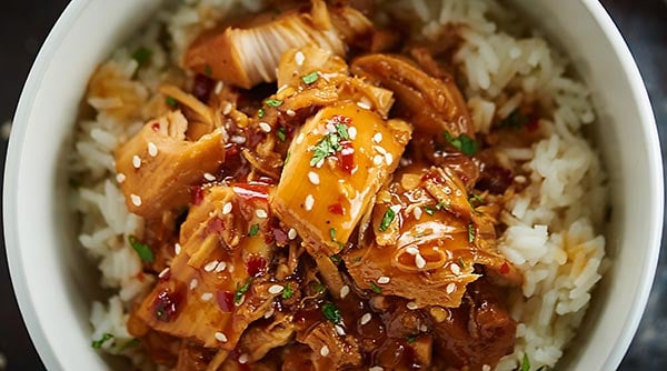 This Crockpot Orange Chicken is better than take out! It tastes better, is so much healthier, and is ridiculously easy to make. Orange chicken for the win! showmetheyummy.com #crockpot #orangechicken