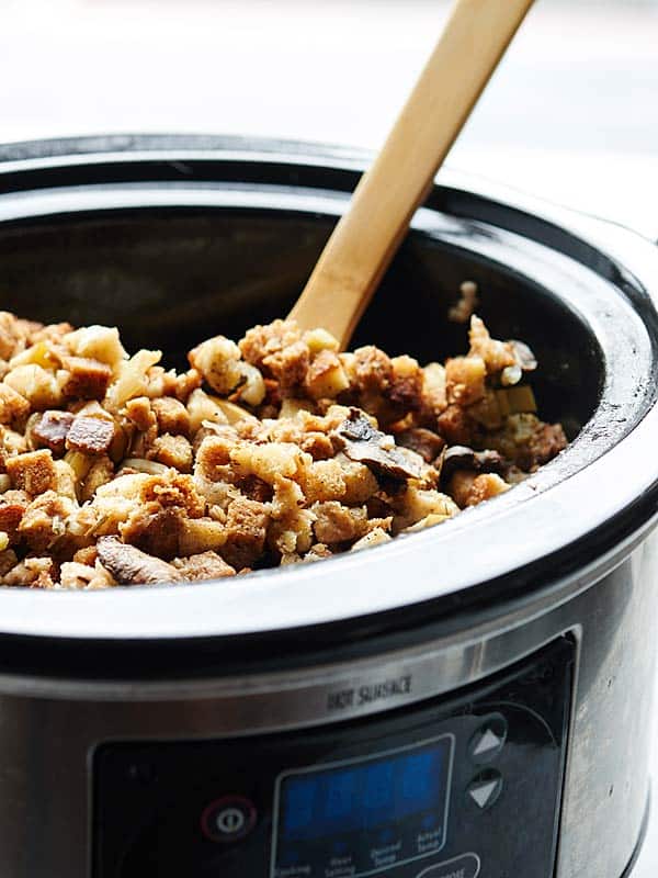 vegetarian stuffing in crockpot with wooden spoon