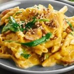 This One Pot Pumpkin Pasta only dirties one dish and is full of healthy, delicious ingredients like whole wheat pasta, spinach, and apple chicken sausage! showmetheyummy.com #pumpkin #pasta