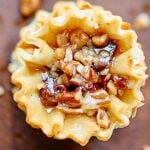 These pecan pie bites are cute, bite sized, quick & easy to make, & filled w/ a maple bourbon caramel. Chocolate chips are optional, but highly recommended! showmetheyummy.com #thanksgiving #pecanpie