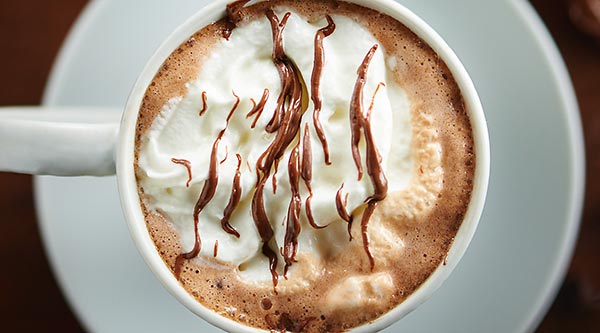 This Crockpot Nutella Hot Chocolate only takes 5 minutes to prep and 2 hours to cook! It's the easiest recipe you'll ever make and is full of nutella! showmetheyummy.com #nutella #hotchocolate