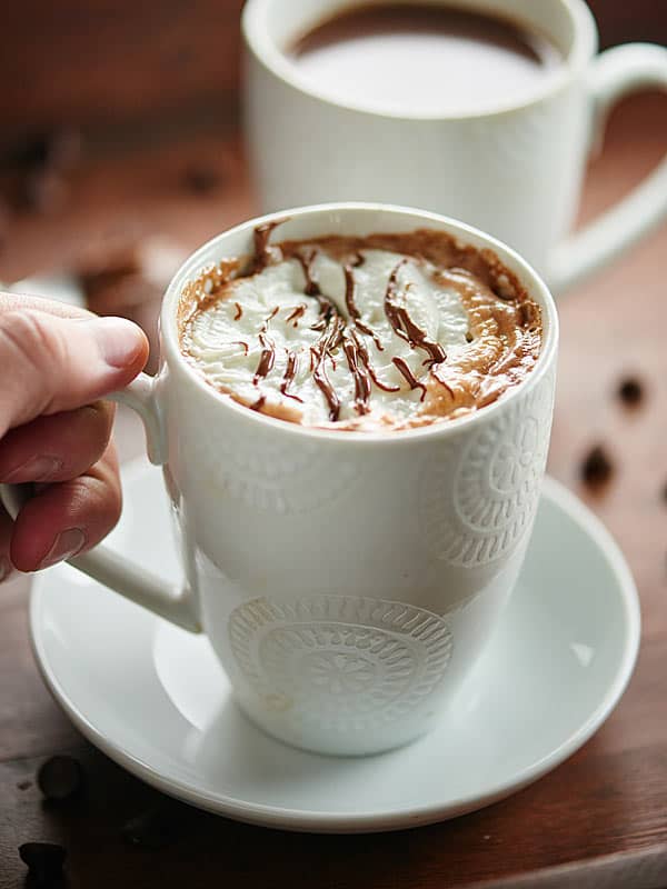 mug of nutella hot chocolate being picked up