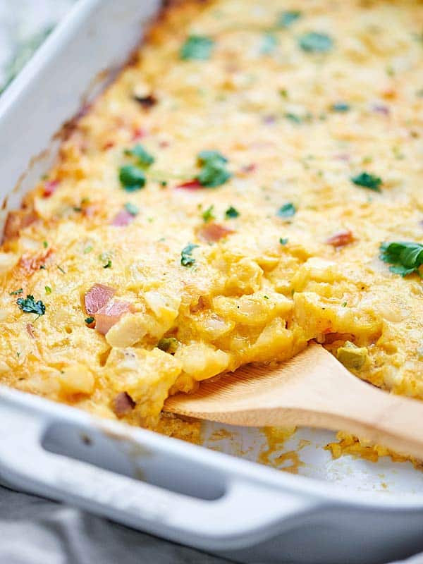 This Ham and Cheese Breakfast Casserole Recipe is SO quick & easy (less than 10 minutes of prep) and full of hash browns, eggs, ham, and plenty of cheese! showmetheyummy.com #breakfast #casserole
