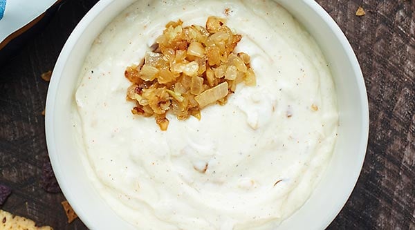This Healthy French Onion Dip Recipe is lightened up w/ non fat greek yogurt, olive oil mayo, & is full of yummy spices! The perfect dip for your chips! showmetheyummy.com #healthy #frenchoniondip #spon #foodshouldtastegood @foodshouldtastegood