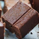 This Holiday Chocolate Fudge takes 2 minutes to make in the microwave & is full of egg nog, bourbon, cinnamon, & nutmeg! The easiest holiday candy recipe! showmetheyummy.com #candy #fudge