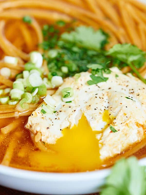 closeup of egg in bowl of asian noodle soup