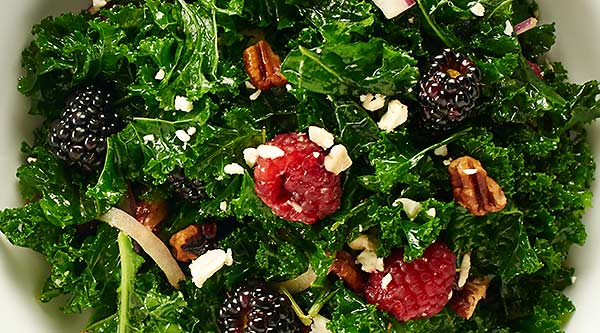 This Balsamic Kale Salad Recipe is quick & easy, so healthy, & full of creamy feta, toasty pecans, & tart berries. All smothered in a balsamic vinaigrette. showmetheyummy.com #kalesalad #balsamicvinaigrette