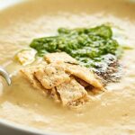 A lightened up version of potato leek soup, this Cauliflower Leek Soup Recipe is made in the crockpot, has about 100 calories per cup, and is so cozy! showmetheyummy.com #crockpot #cauliflower